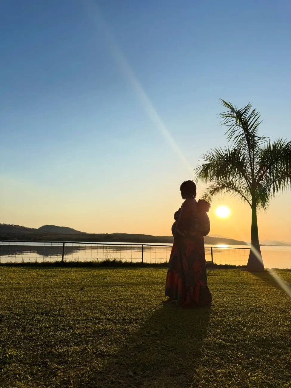 A quiet sunset moment with a parent and child